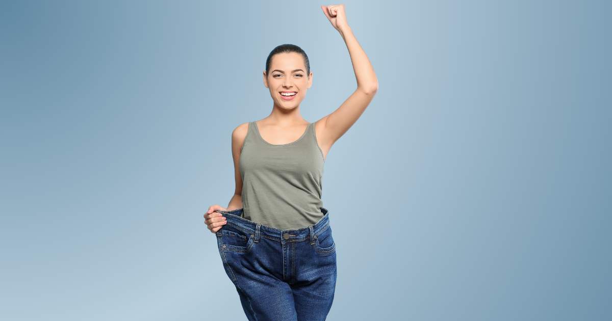 An image of a woman looking happy after losing weight from Semaglutide.