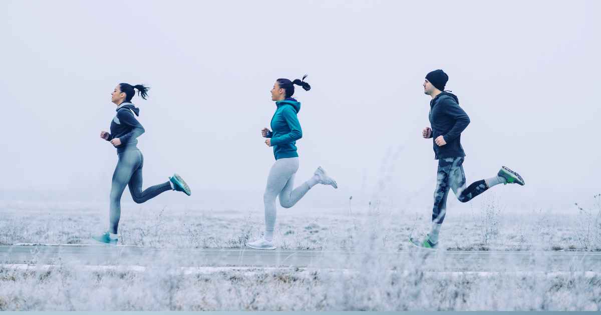 Image of three people running.